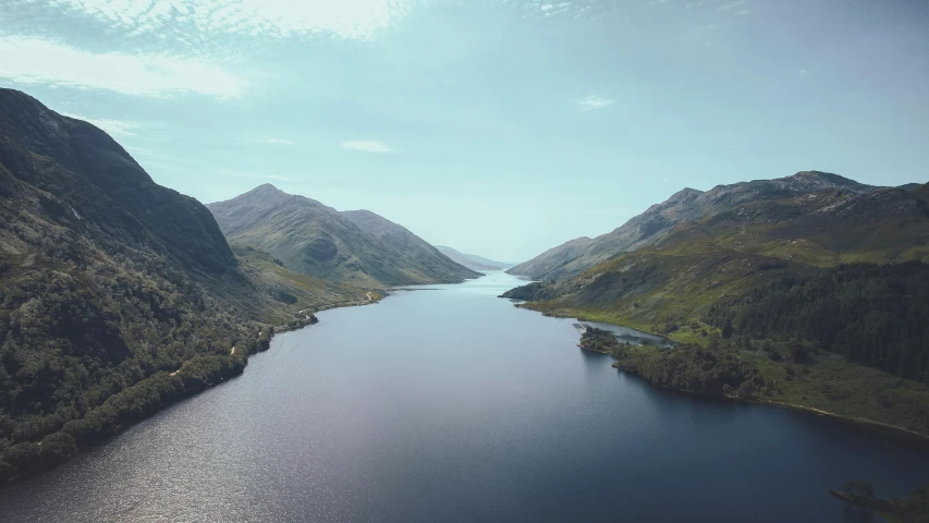 an aerial view of a river in the mountains