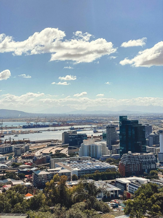 a city in the distance surrounded by lots of tall buildings