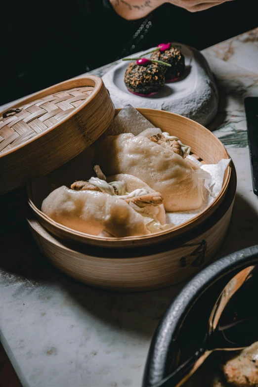 a wooden container filled with some food on top of a table