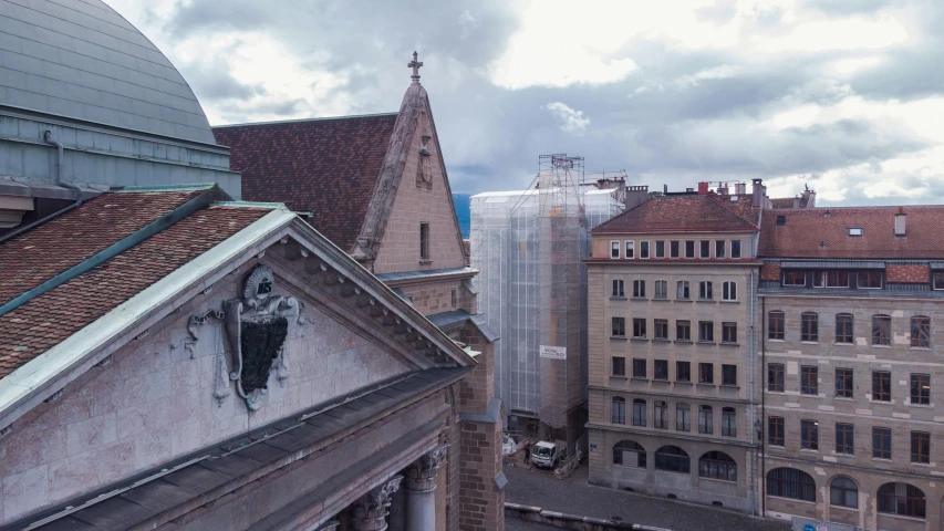 view of buildings from above a cloudy sky