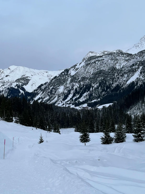 a man on skis with a mountain in the background