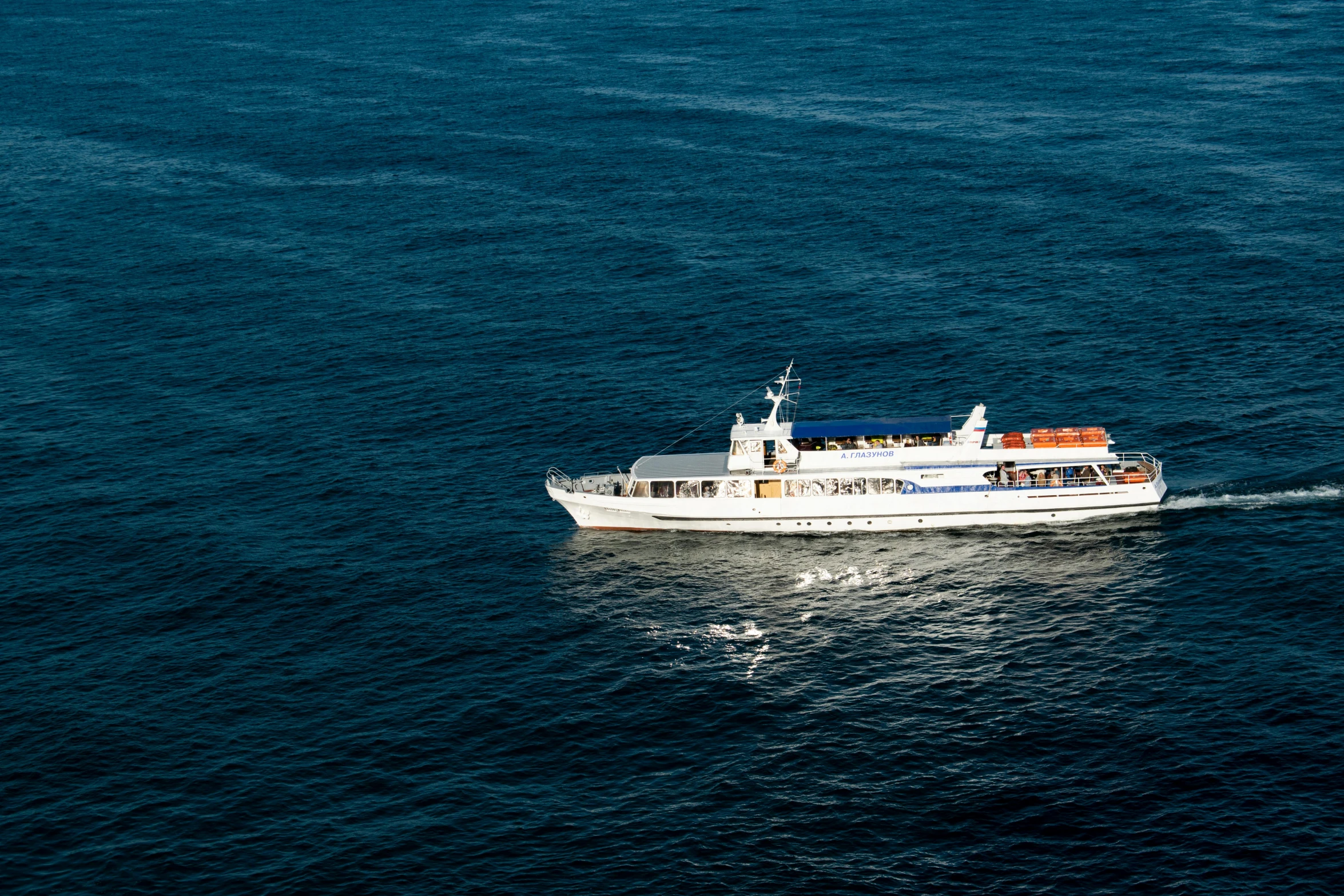 the boat is riding on a large body of water