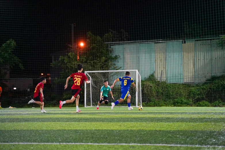 a soccer field filled with people playing soccer