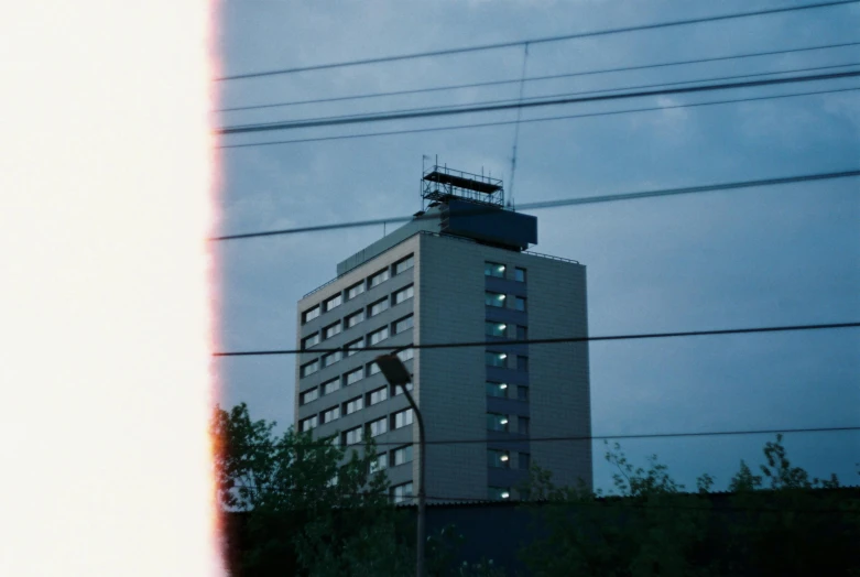 a tall building with a sky background