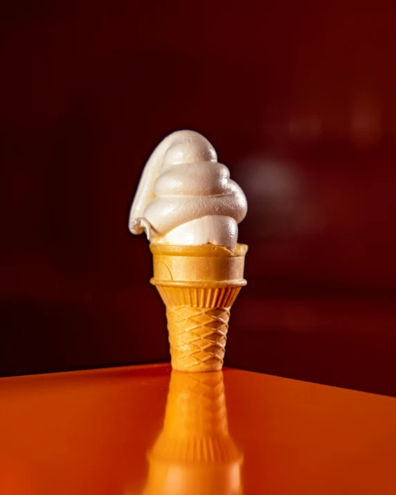 a sundae cone sits atop an orange table
