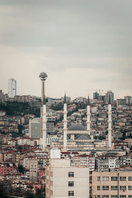 an urban city with many tall buildings with towers