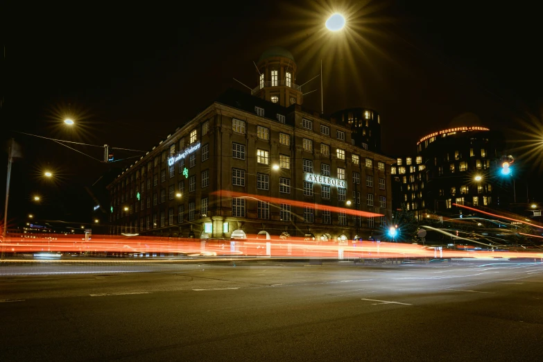 light streaks on the dark streets with buildings