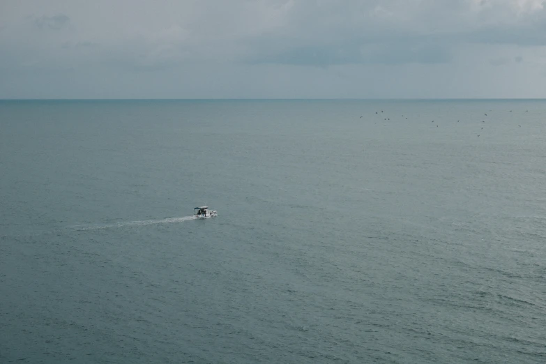 a boat floating on top of a body of water