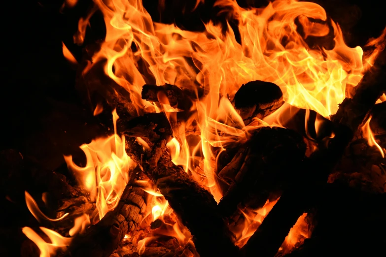 close up image of fire with dark background