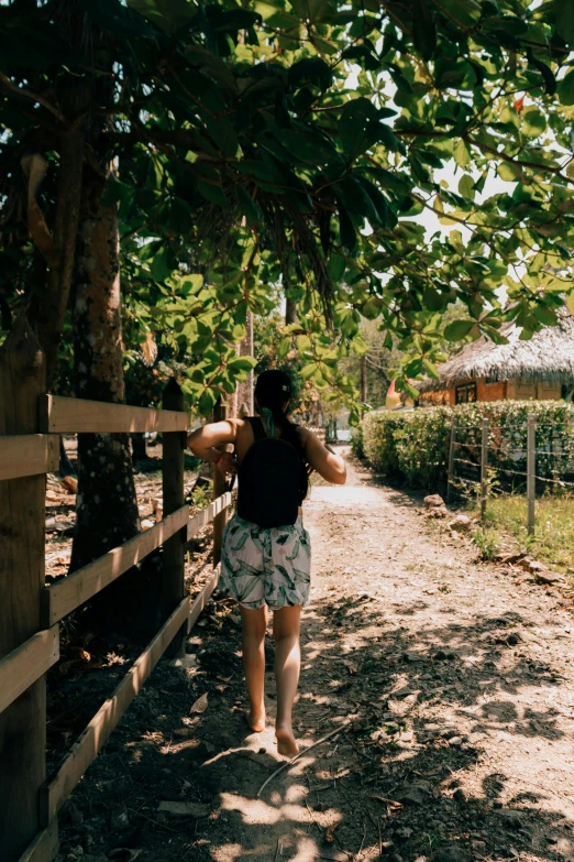 an image of a woman walking down the trail