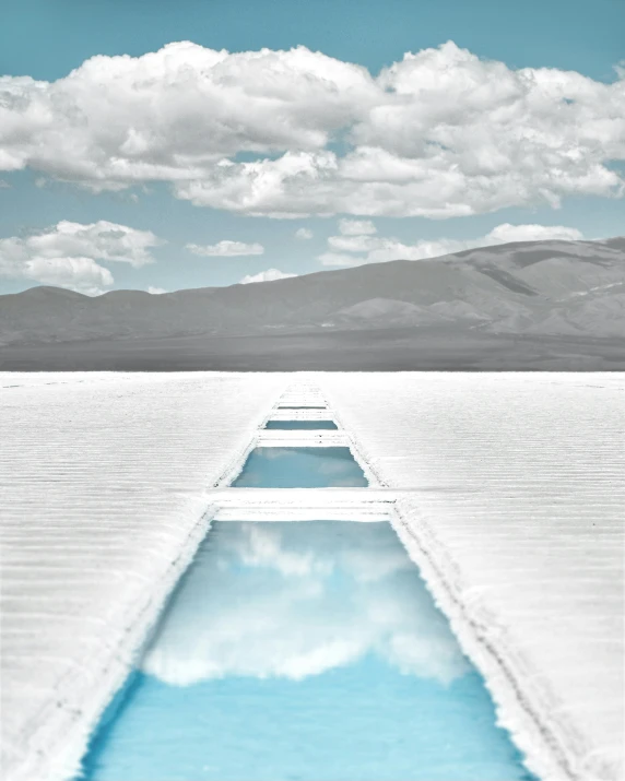 a beach view of the blue sky and clouds