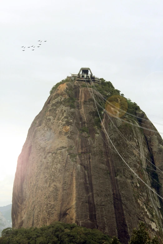 a view of a very tall structure on a mountain