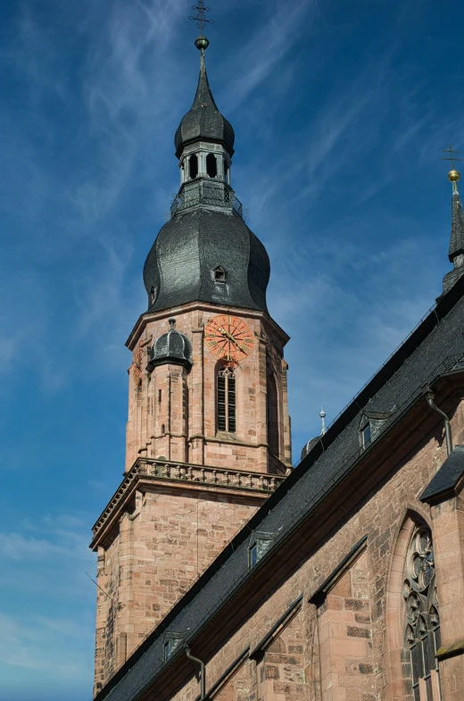 an old building with a steeple and a clock tower