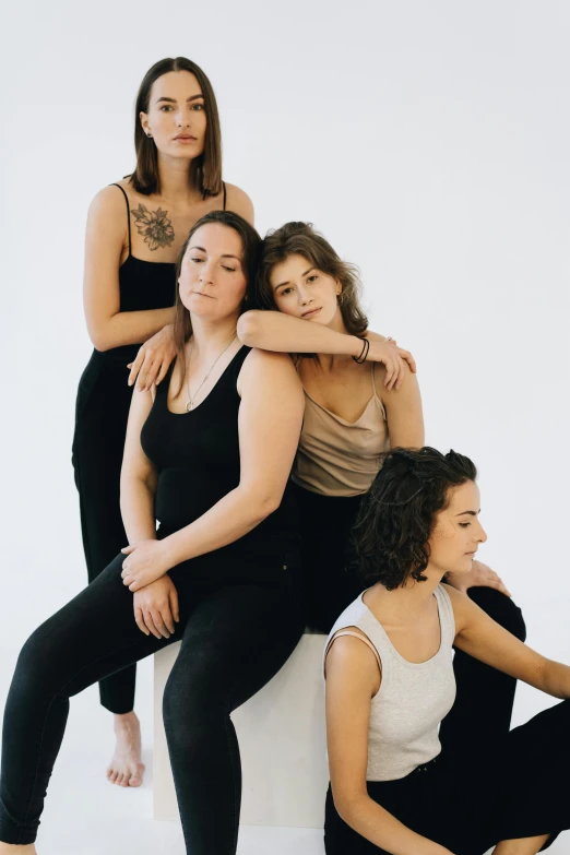 five female dancers posing for a po