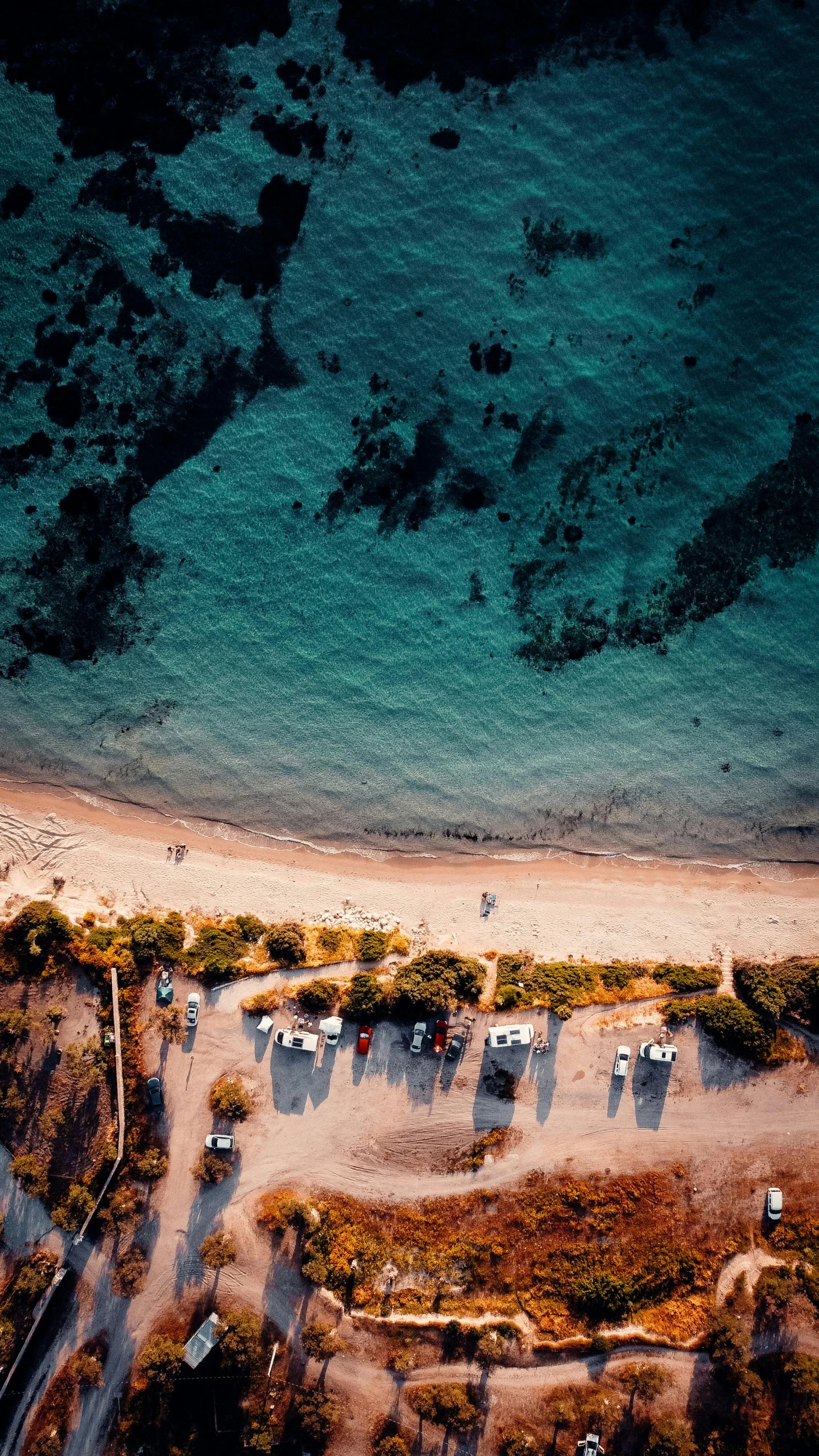 an aerial s of some tents set up on the beach