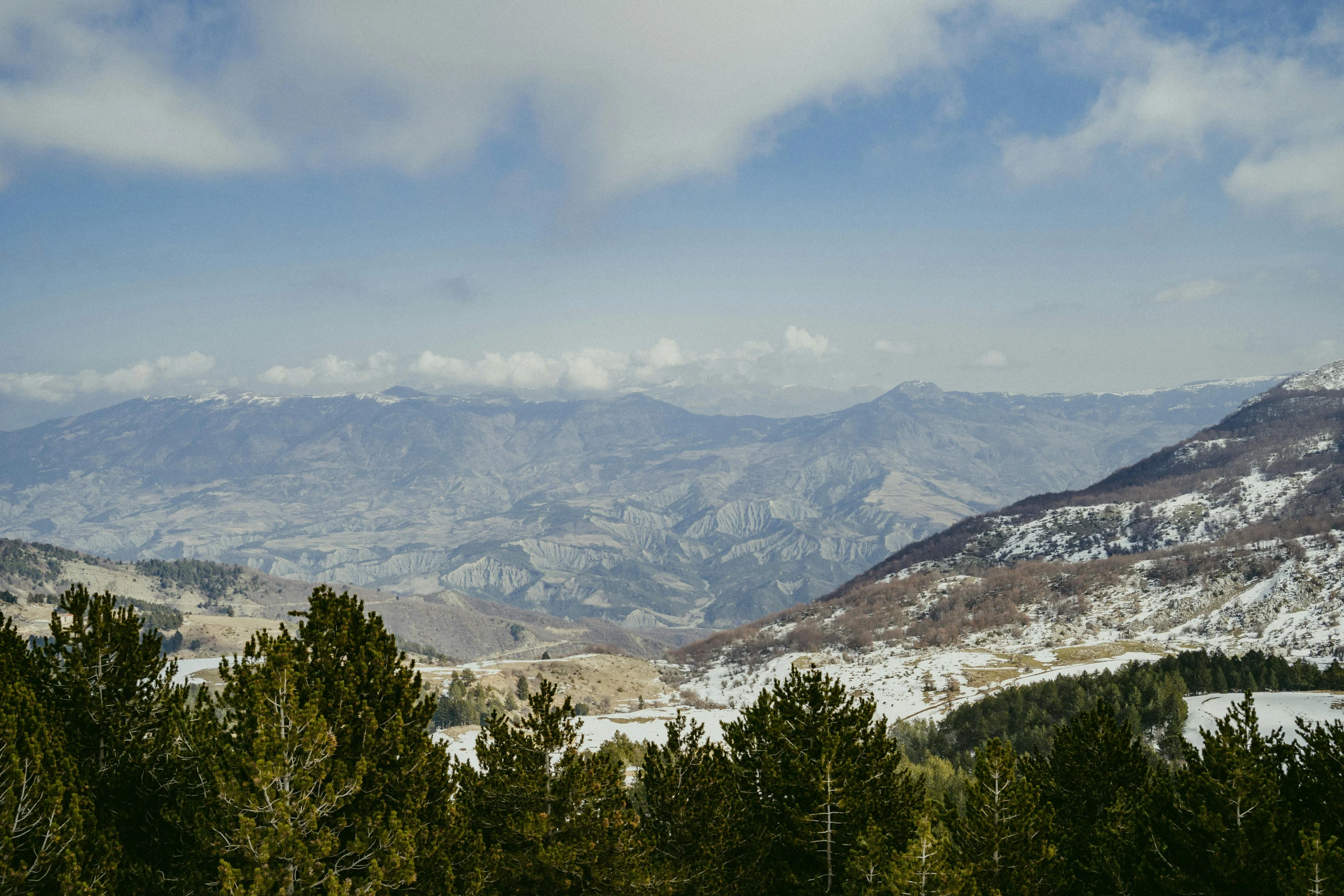 the view over the mountains in the winter