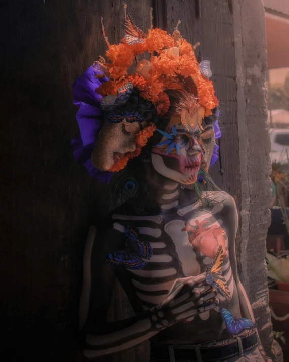 a painted skeleton in full body makeup with orange hair