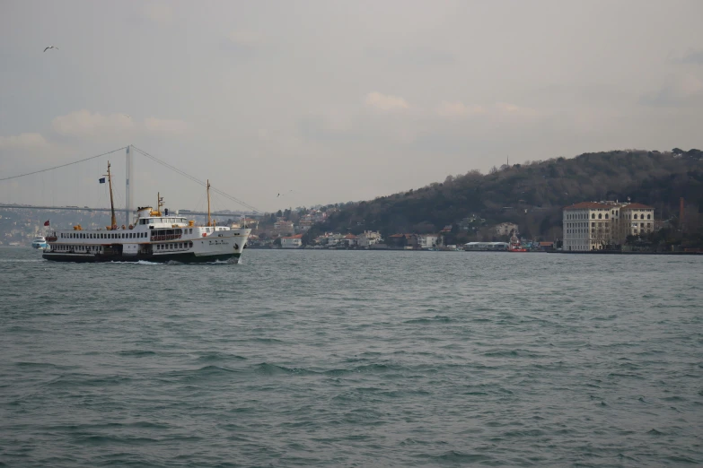 two ferry boats are sailing on the water