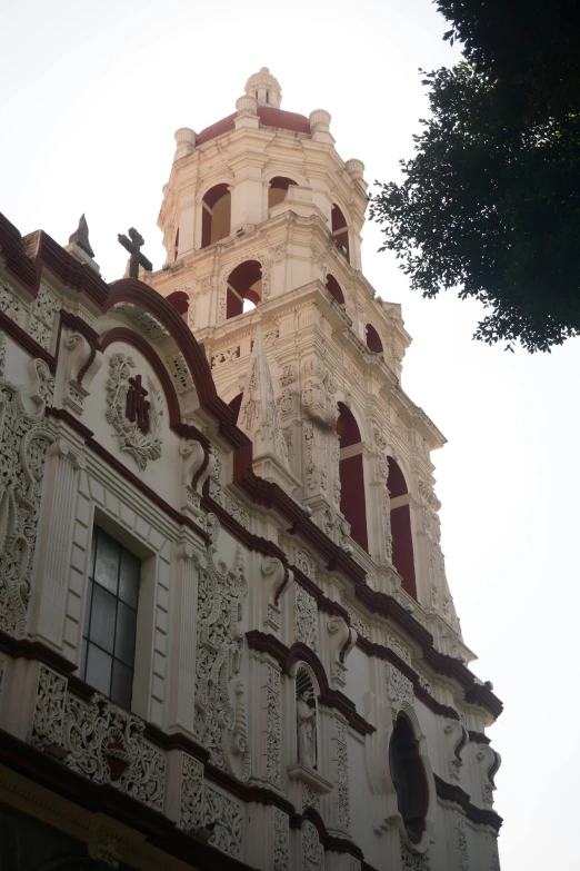 the top part of a building with some birds perched on it