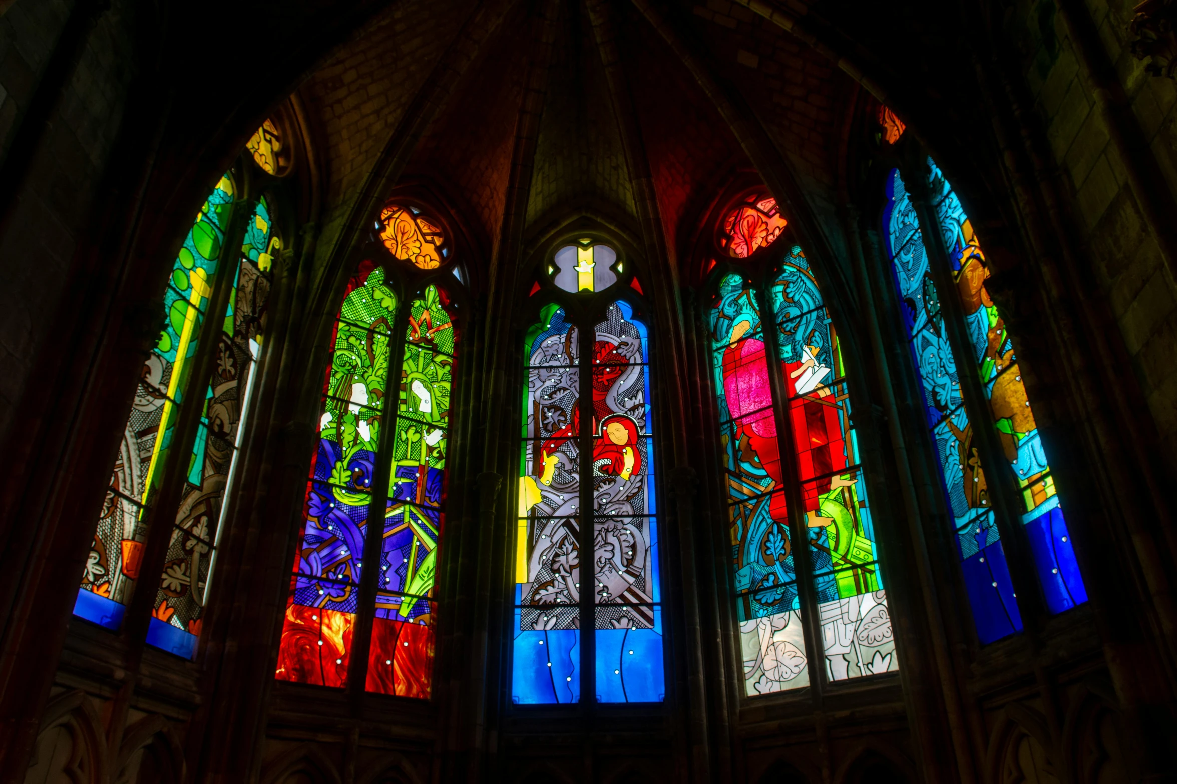 multi - colored glass window in old building with intricate details