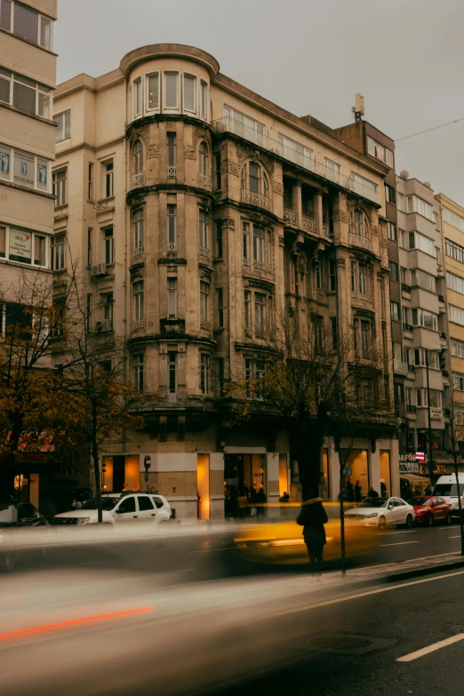 a large building in a city on a rainy day