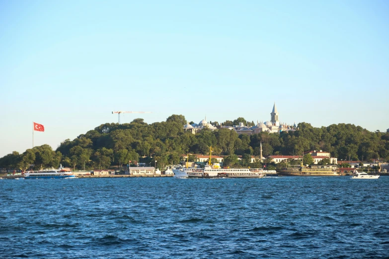 a view of the water with boats and buildings on top