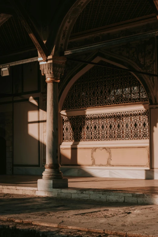 a large pillar sitting in front of a building