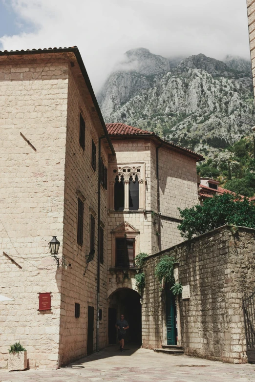 a building with mountains in the background