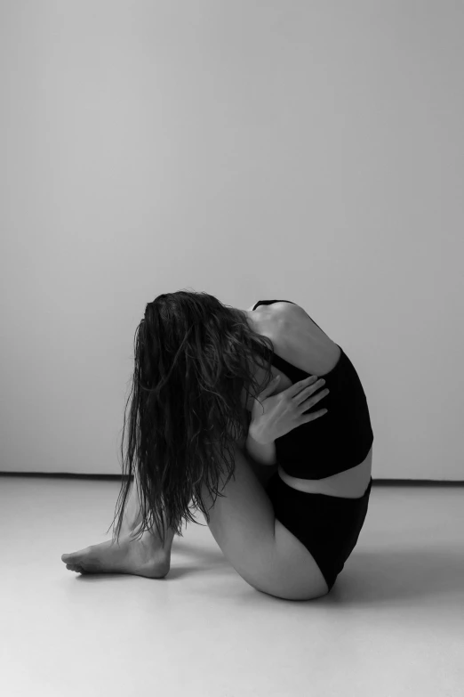 woman laying in a bare spot on the floor