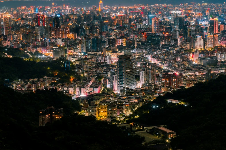 a city in the middle of a hill at night