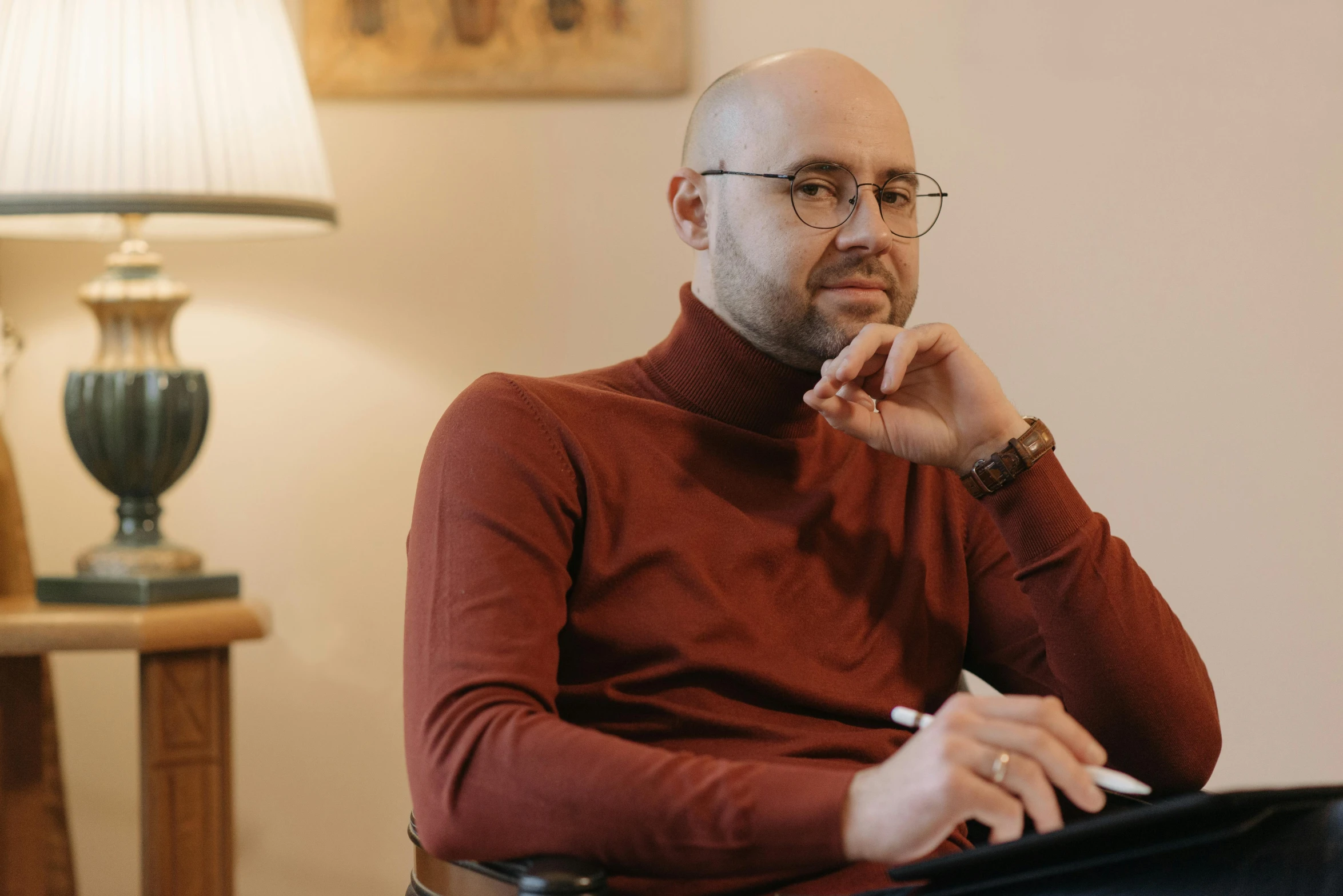 an image of a man sitting on his couch