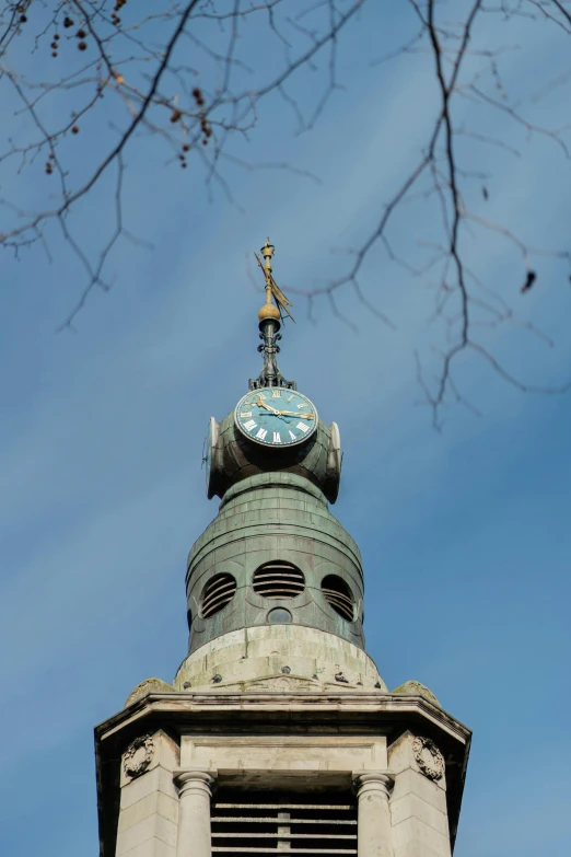 this is a view of a clock tower, looking up