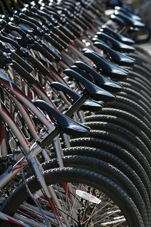 a rack with many bikes lined up on it