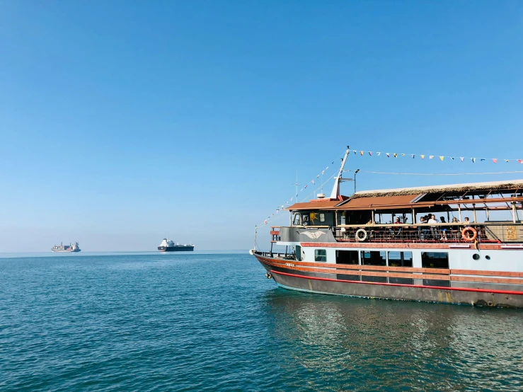 a large boat floating across a body of water