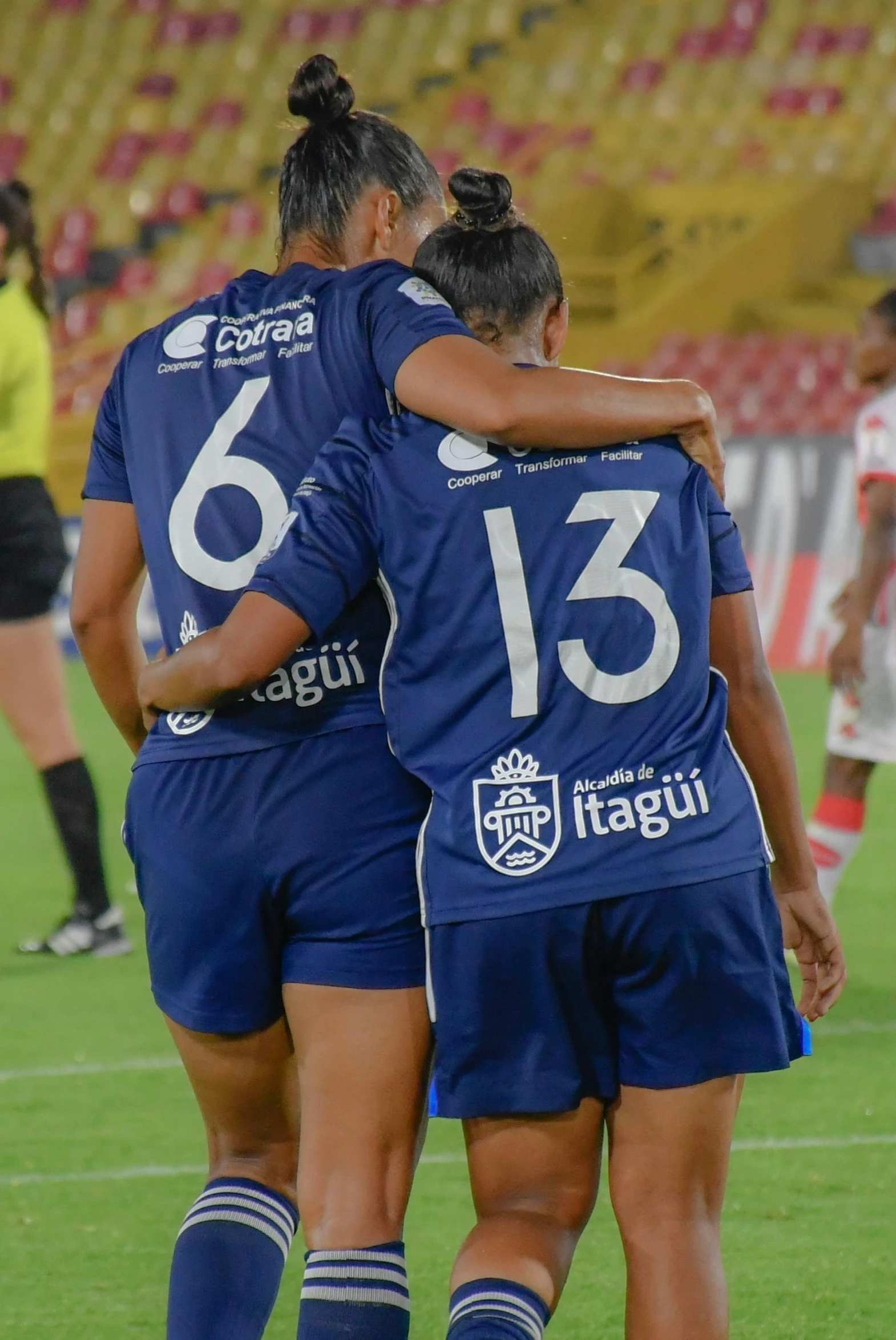 a group of women on a field during a game