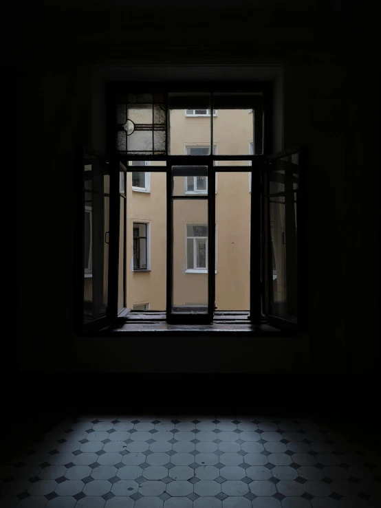 an open window in a building with star designs on it