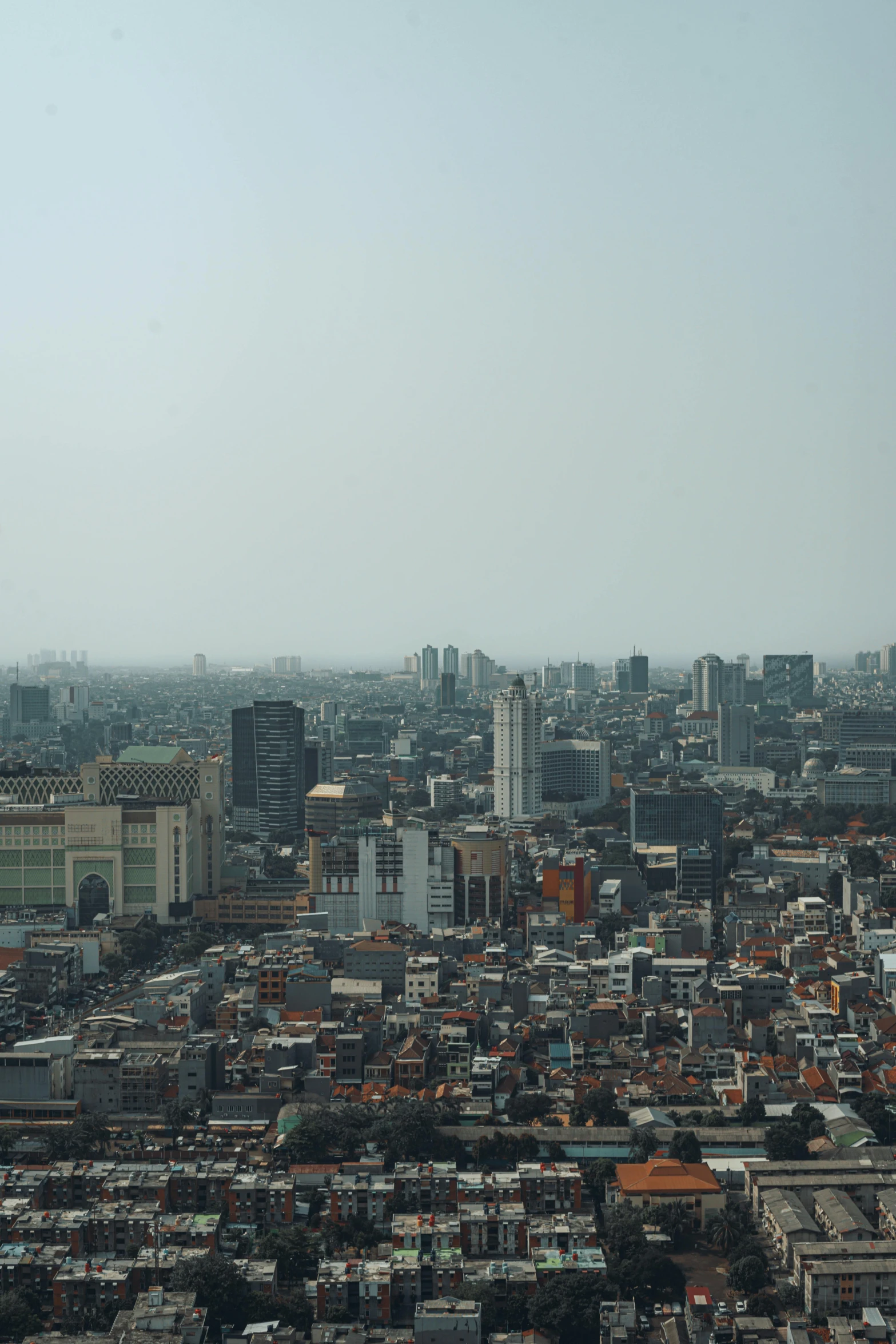 a bird's eye view of a city with tall buildings