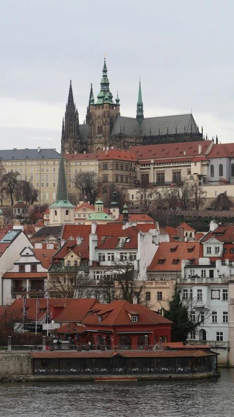 view of many old buildings with spires in the background