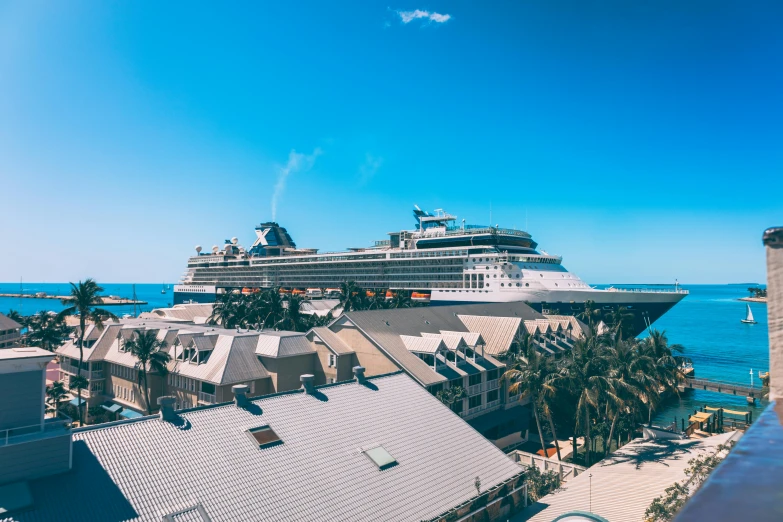 a cruise ship docked on the water next to buildings