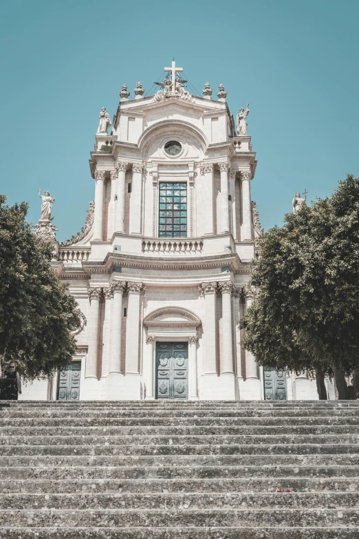 this is a very large white church with many windows