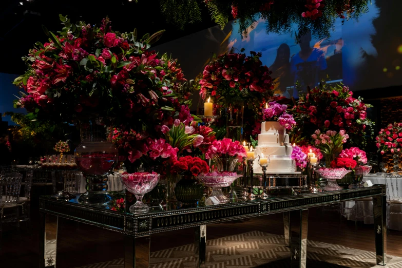 a table with flowers and candles on it