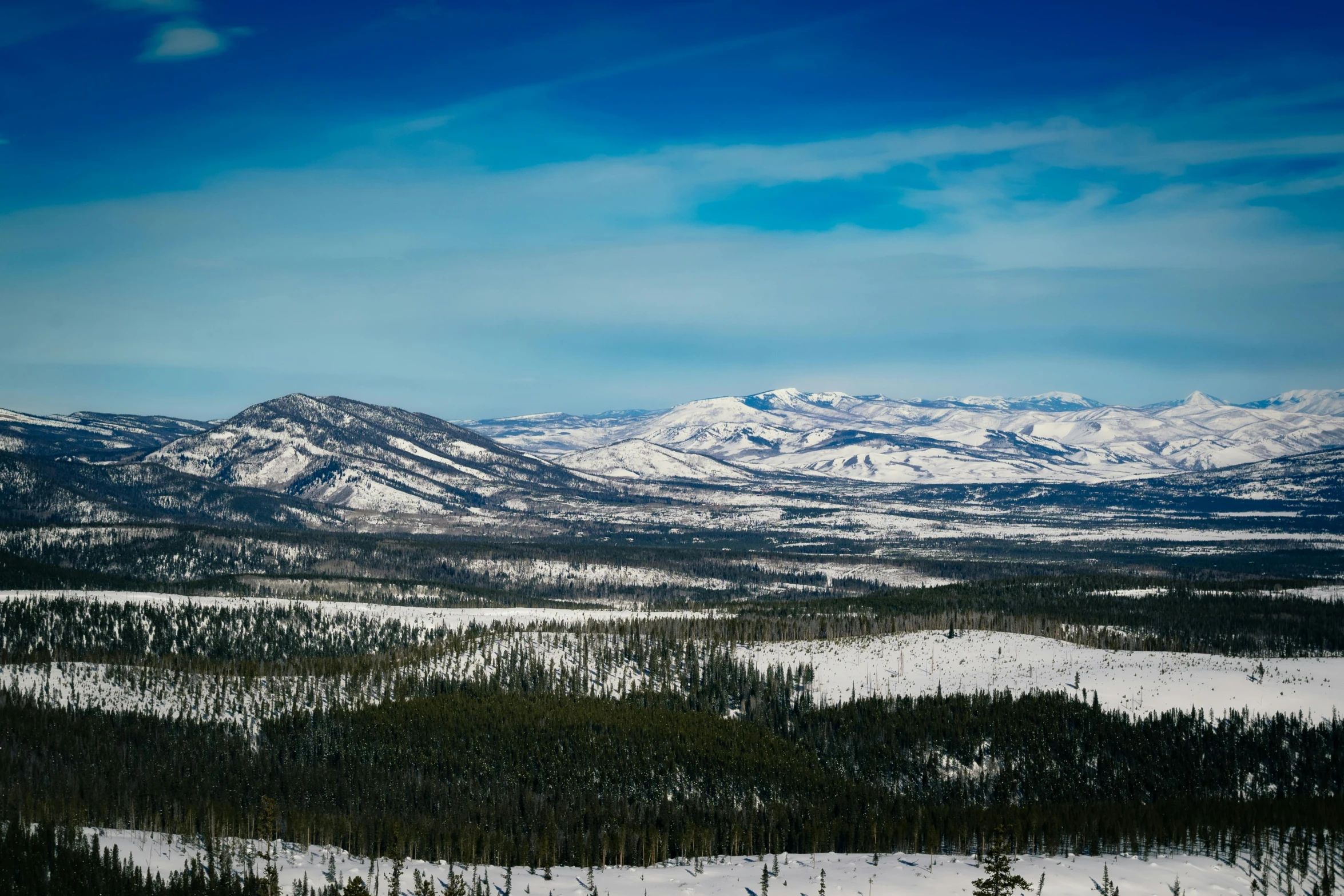 the view of a snowy mountain range from above