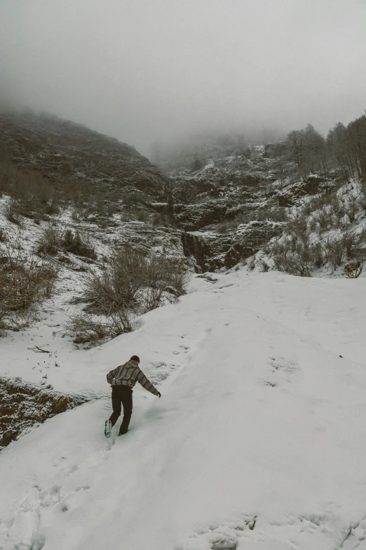 a person on skis rides down a trail on a mountain