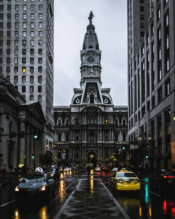 a very tall clock tower in the city