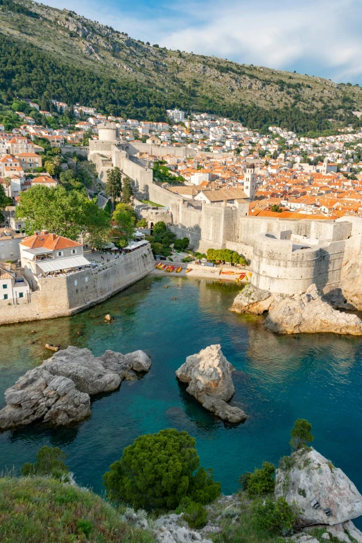 aerial view of an island and the city with orange roofs