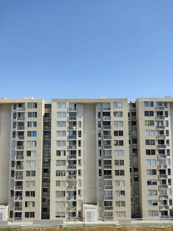 a clock tower sitting next to an apartment building