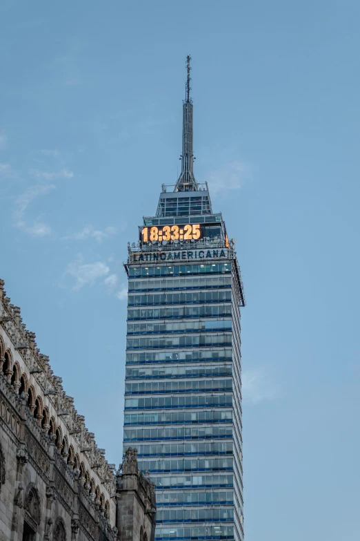 tall, cylindrical buildings are located in the city