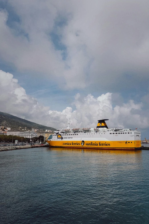 a large passenger boat is parked on the water