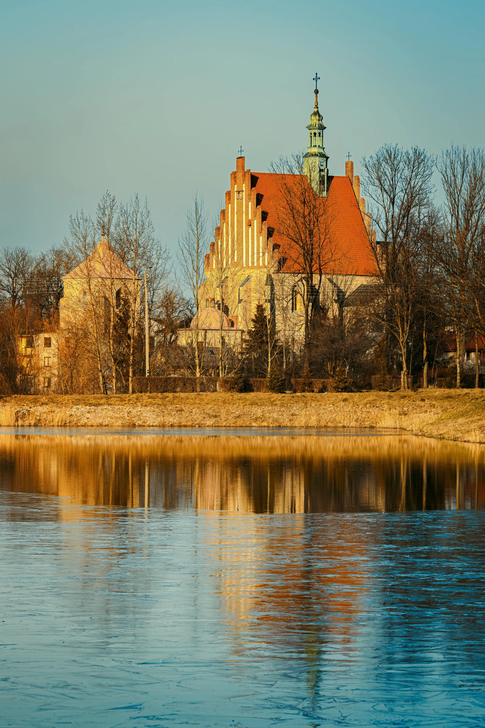 a small river flowing past a large building