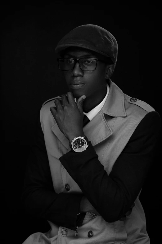 a man is posing for a portrait wearing glasses